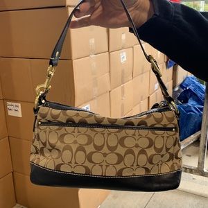 Coach signature; dark brown leather trim.  Gently used.